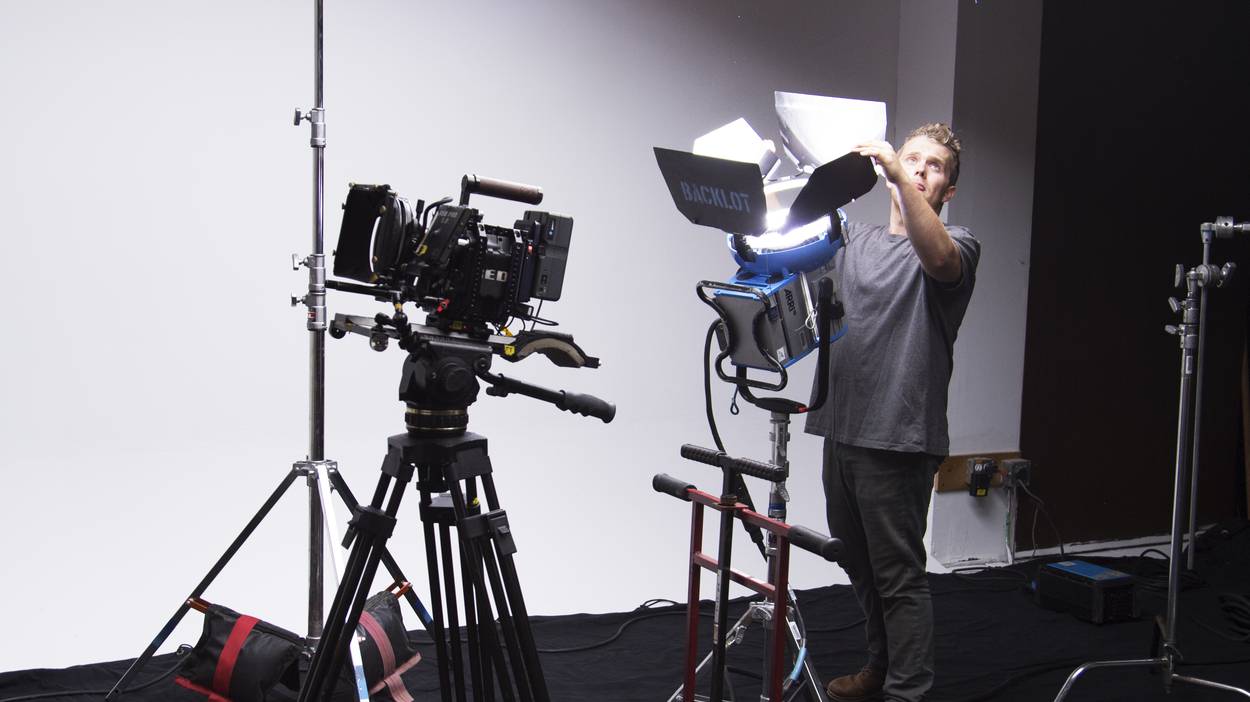 Adjusting the tracks and lighting setup for the "Running to Glory" spot.